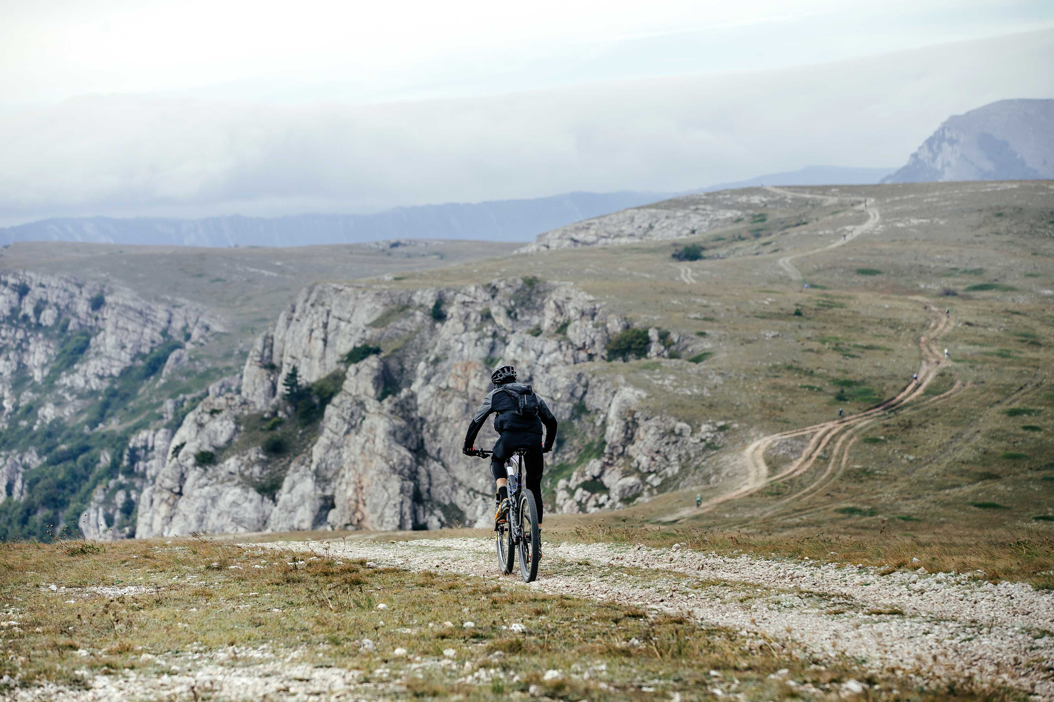 Cyclists on a rocky trail