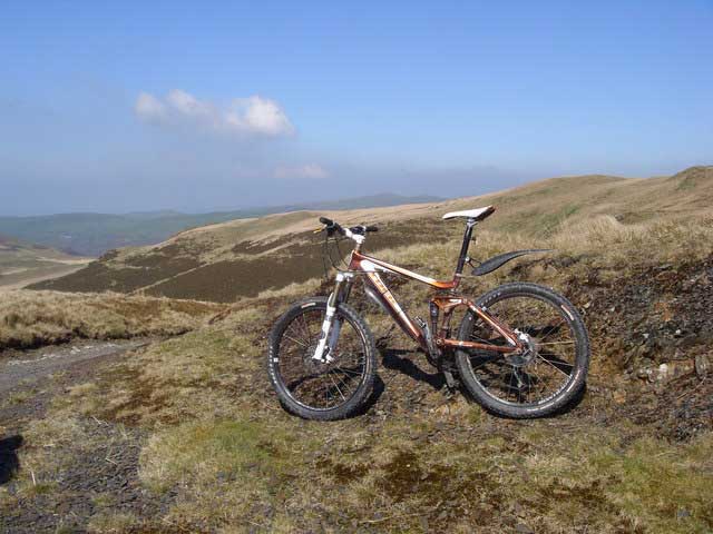 A white and orange mountain bike